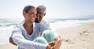 An older couple on the beach.