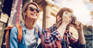 A couple on vacation taking pictures. 